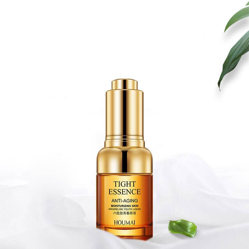 A golden bottle of Sweet Deals Care And Brightening Skin Care Products anti-aging moisturizer with hyaluronic acid on a white background with a green leaf partially visible in the corner.