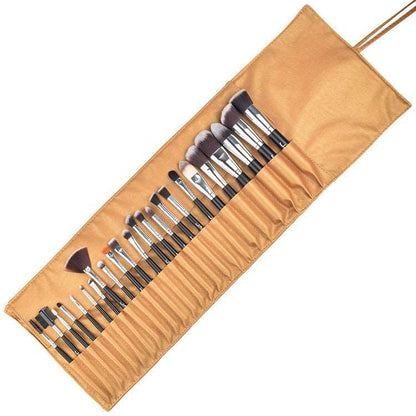 A set of 24 Sweet Deals makeup brushes neatly arranged in an open, rolled-out beige fabric holder with slots to organize each brush.