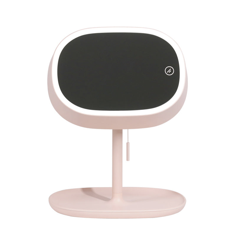 A modern, minimalist Sweet Deals home security camera with a pale pink base and stand, featuring a sleek black face and a single visible touch type switch.