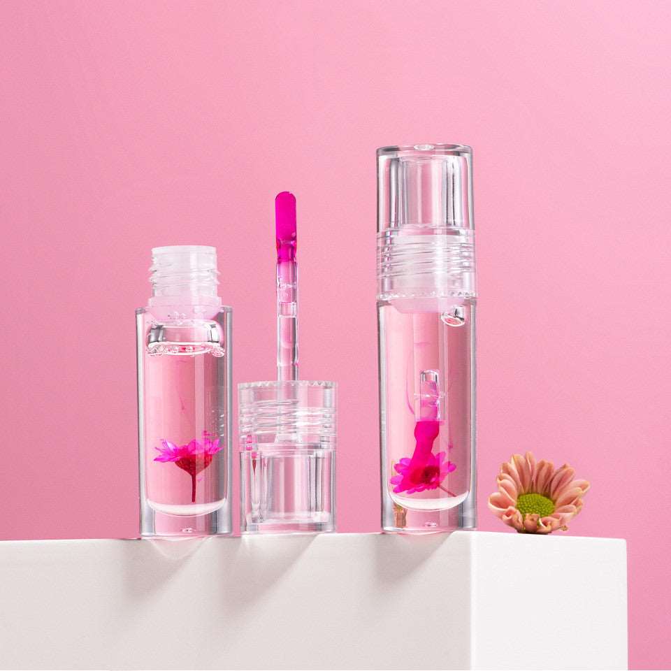 Three Flower Color Changing Lip Oil Moisturizing Jelly Lipgloss Clear Temperature Change Liquid Lipsticks Reduce Lip Line Make Up, displayed on a white surface against a pink background.