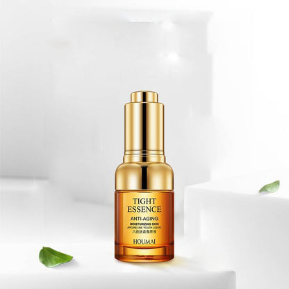 A gold-colored bottle of &quot;Care And Brightening Skin Care Products&quot; by Sweet Deals, enriched with hexapeptide, against a clean, white background, with soft lighting and green leaves.