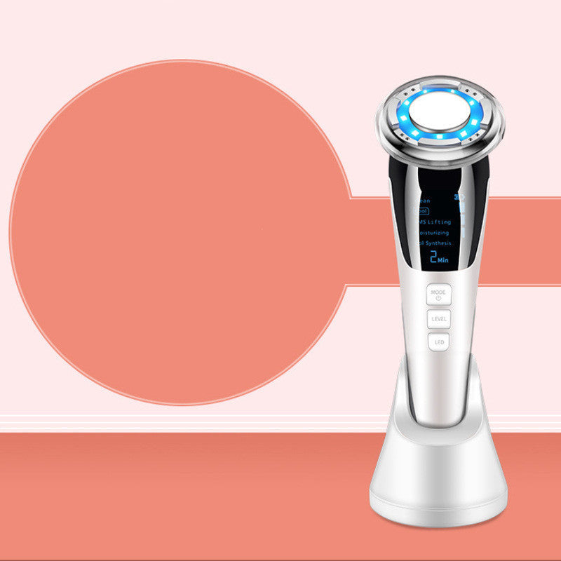 A modern Sweet Deals facial massager with multiple settings displayed on a digital screen, against a dual-toned pink background with a large circular shape on the left side.