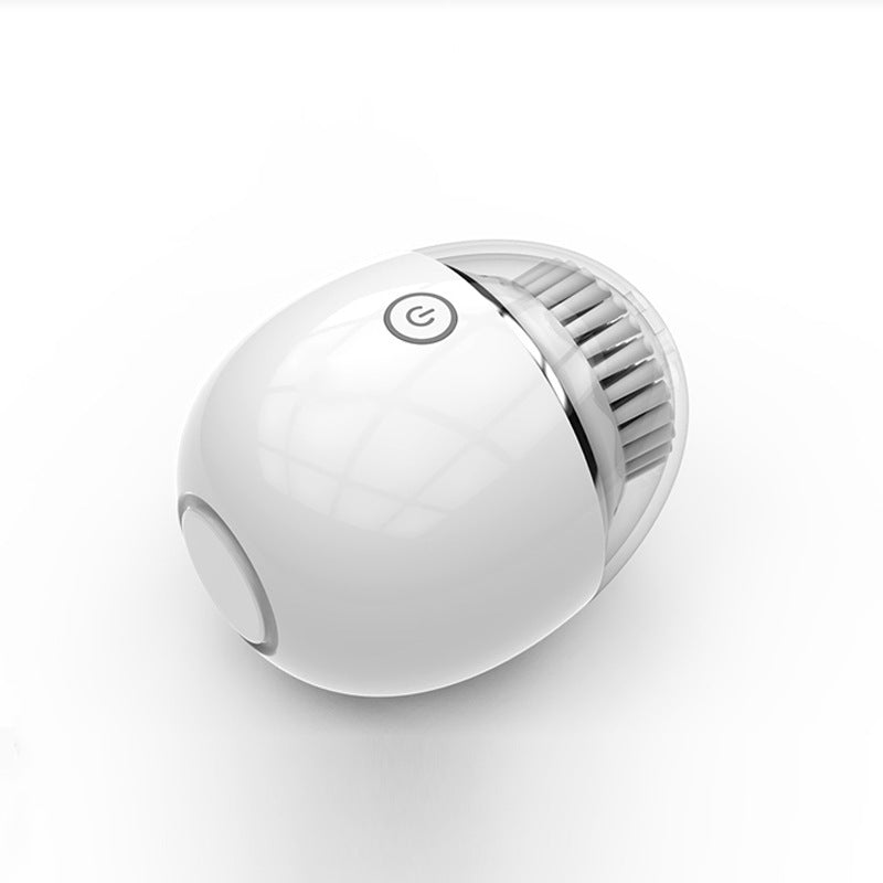 A sleek, modern white round Sweet Deals Ultrasonic electric face washer with a grid-like pattern on one end and a power button symbol on the top, set against a plain white background.