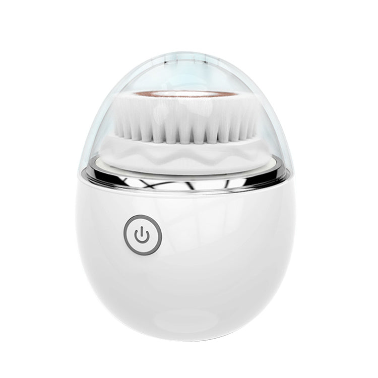 A modern white Ultrasonic electric face washer from Sweet Deals with a transparent top and soft bristles visible at the top, featuring a single power button on the front for sonic cleaning.